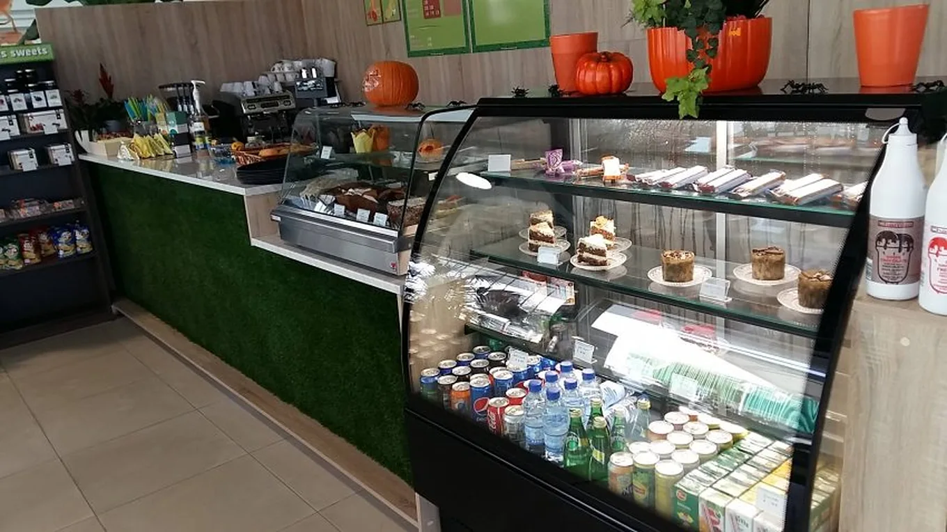 The café counter with a cake display